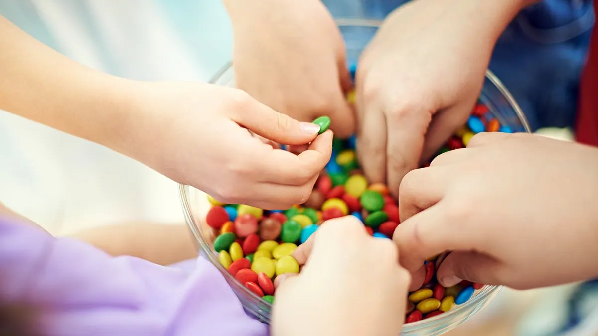 A variety of Halloween treats including lollipops and chewy candies, highlighting the wide range of ingredients under review.