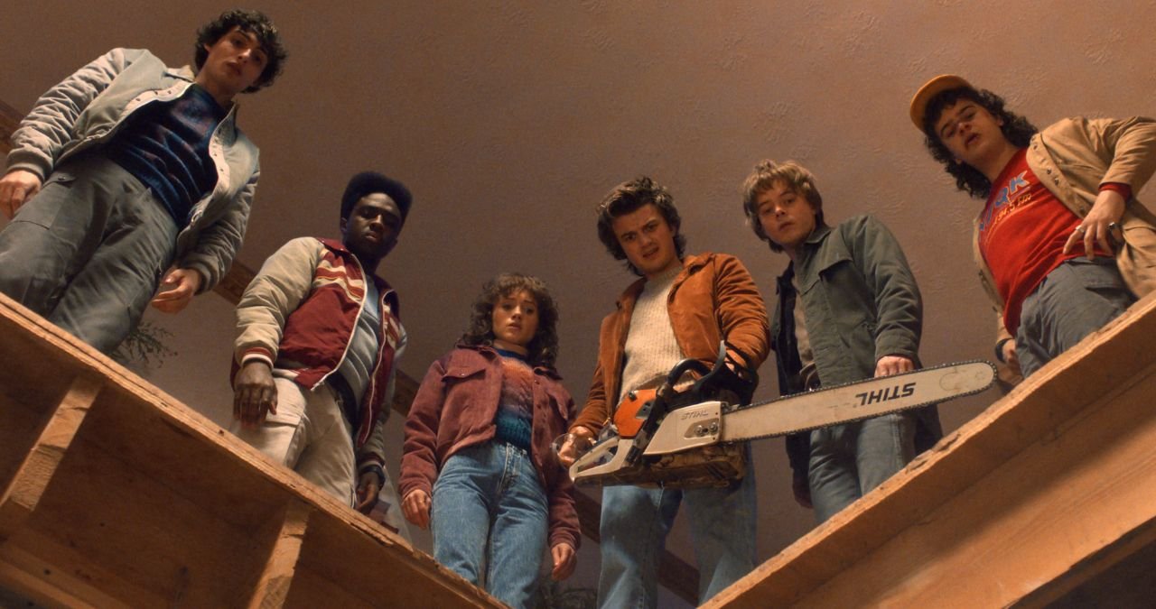 Eleven stares intensely, using her powers.