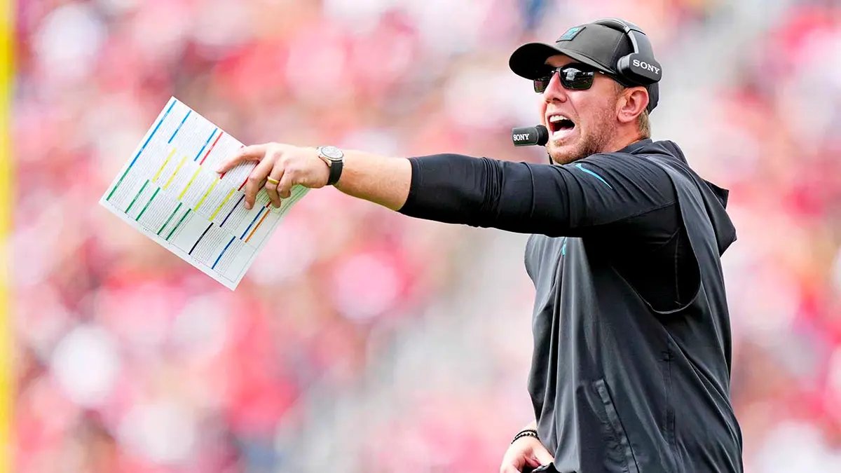 Medical staff attending to an injured NFL player on the field, emphasizing player safety.