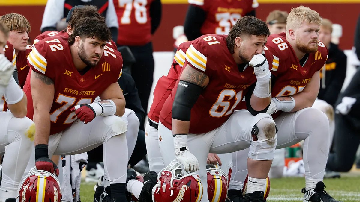 Medical staff surrounding Benjamin Brahmer on the field