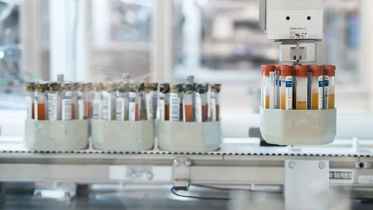 Medical professionals discussing early cancer detection blood test results.