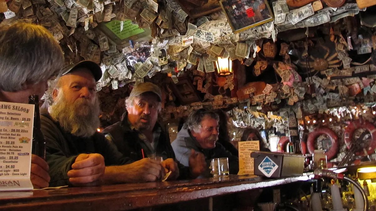 Close-up of a well-worn bar top with spilled beer