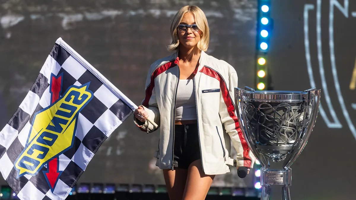 Sydney Sweeney posing with NASCAR drivers