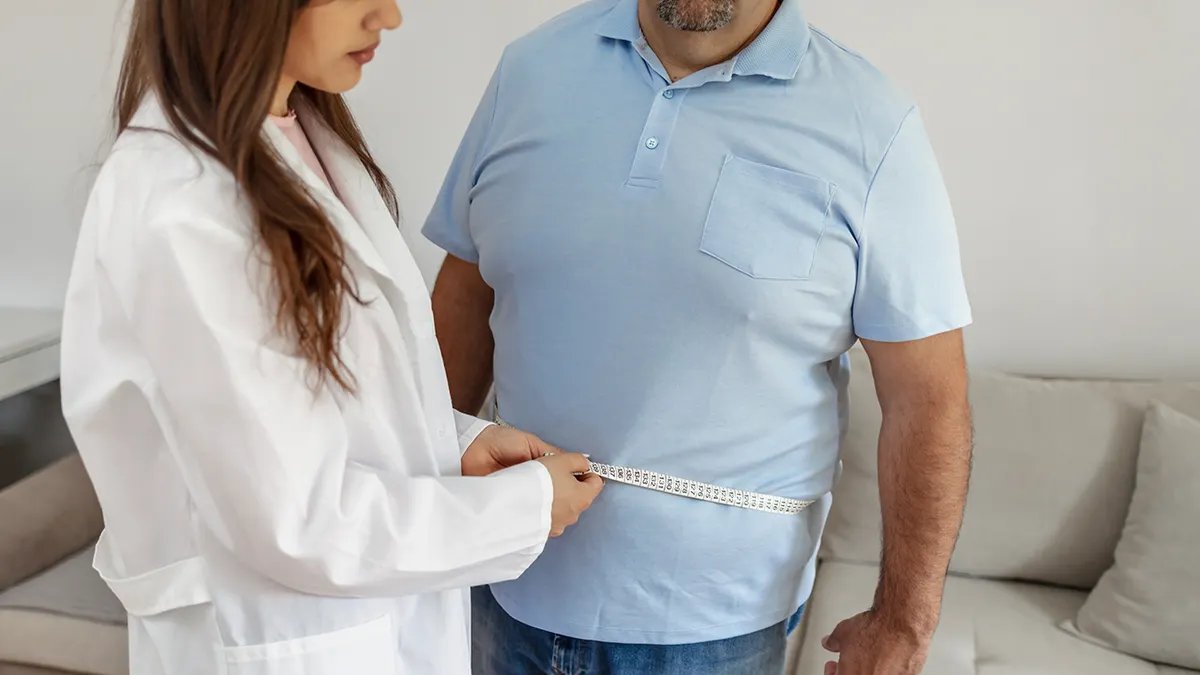 Healthcare professional advising patient on weight management