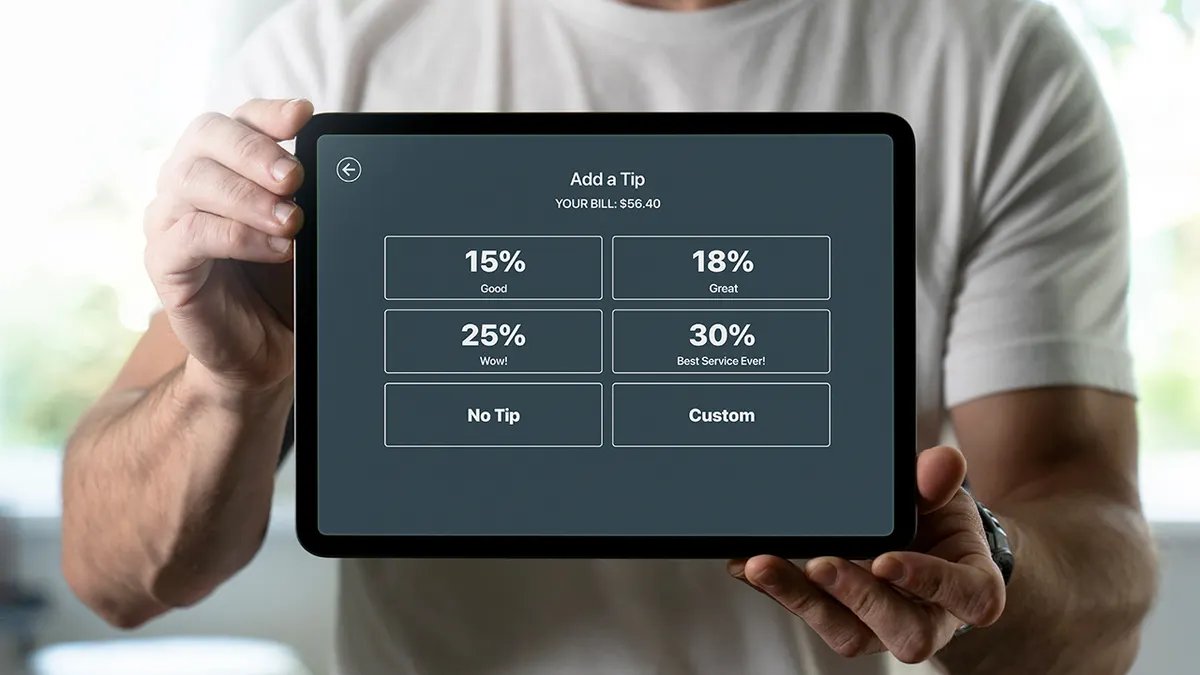 A group of friends enjoying a meal at a restaurant, reflecting on the overall dining experience including payment.