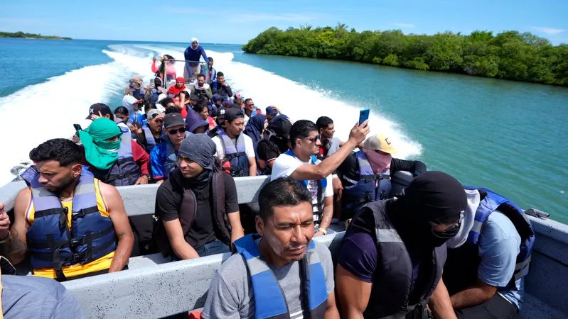 Migrants gathered outside a crowded shelter in Tapachula, illustrating the humanitarian challenges of the altered migration flow.
