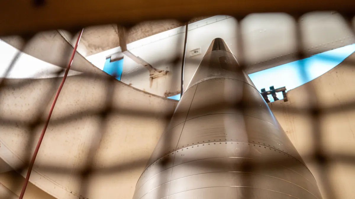 A somber image showing a mushroom cloud, symbolizing the threat of nuclear tests and their global implications.
