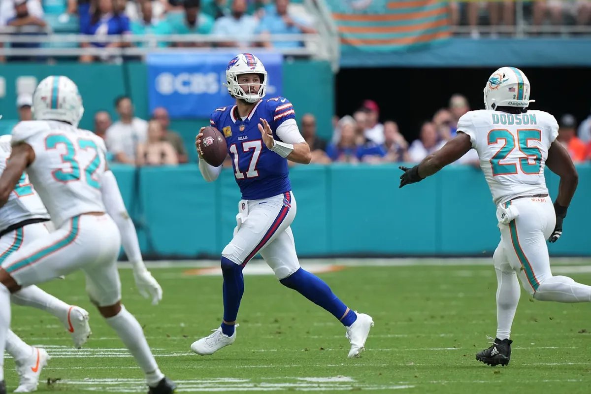 Josh Allen shows intense frustration on the field after a critical play during the Buffalo Bills game against the Dolphins.