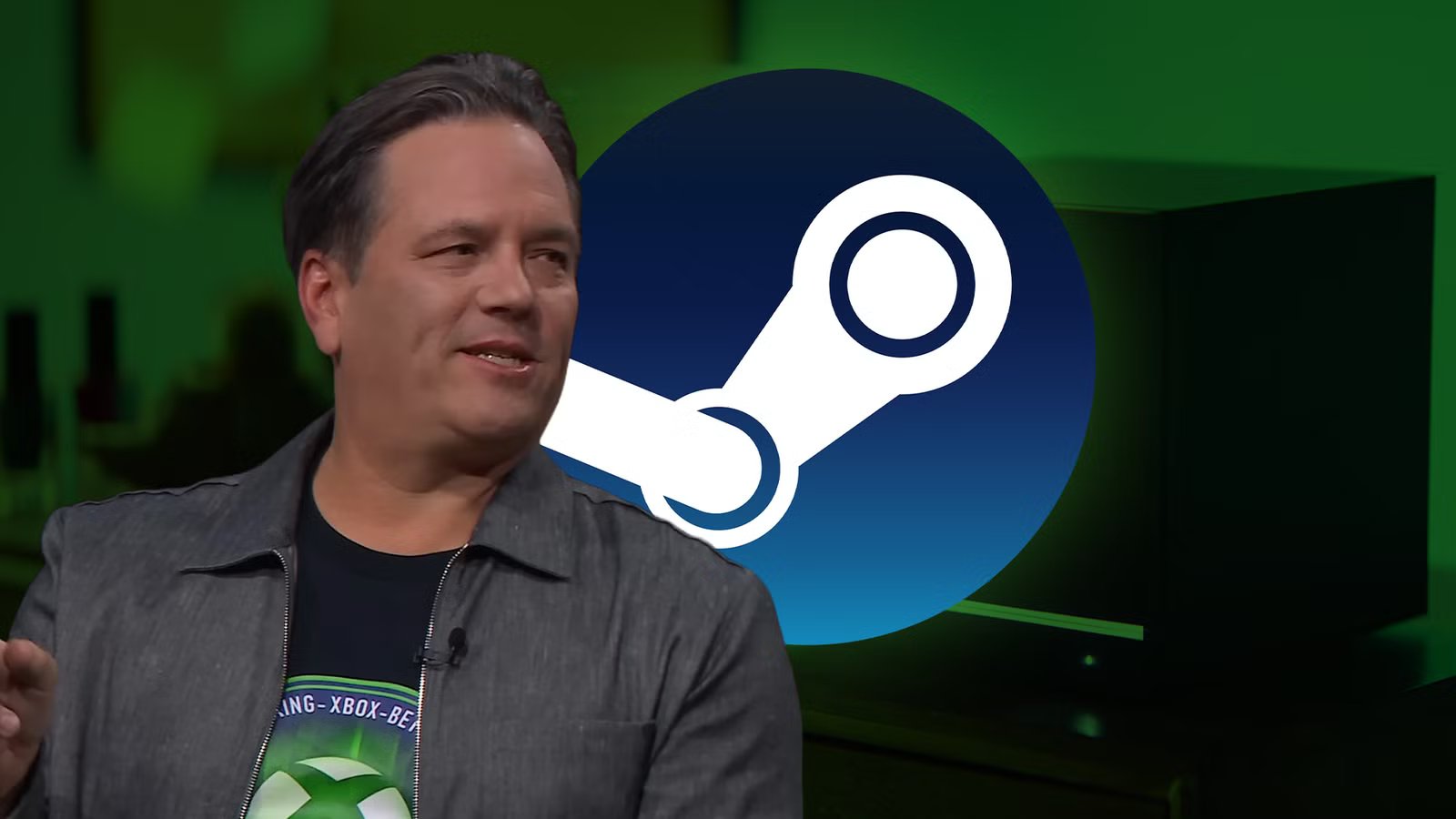 Phil Spencer speaking at a gaming conference, with a thoughtful expression.