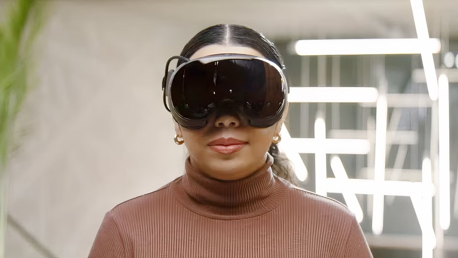 Gabe Newell holding the Steam Frame VR headset during the official unveiling.