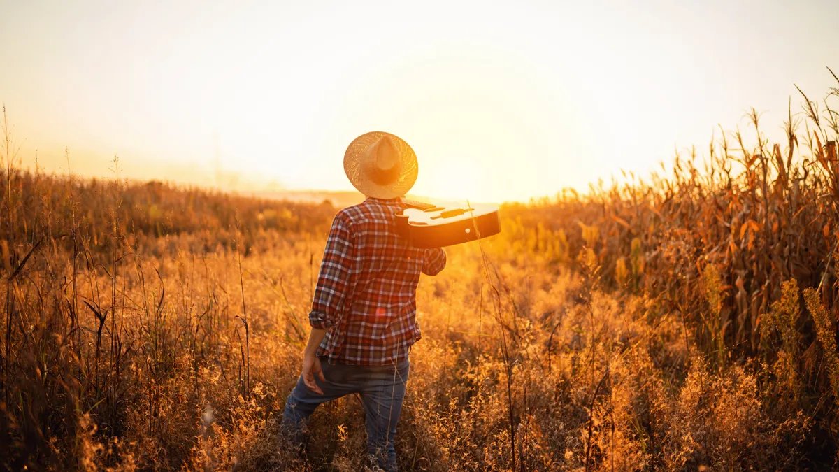 Breaking Rust performs on a virtual stage, surrounded by holographic lights and digital effects.