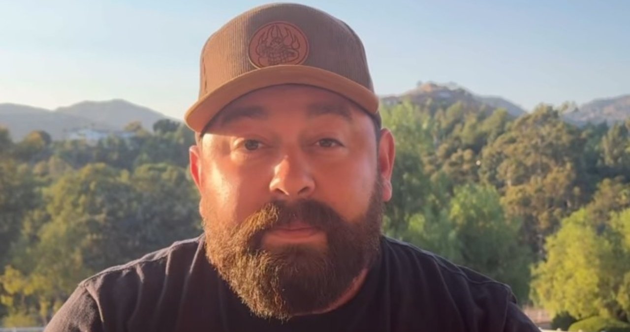 Michael Duarte, the well-known food influencer, is seen here at a recent culinary event, smiling and engaging with fans.