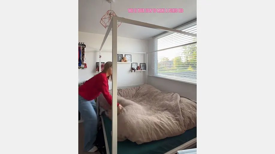 A well-organized collection of soft, folded blankets in various neutral tones, ready to be used for creating a cozy sleep environment.