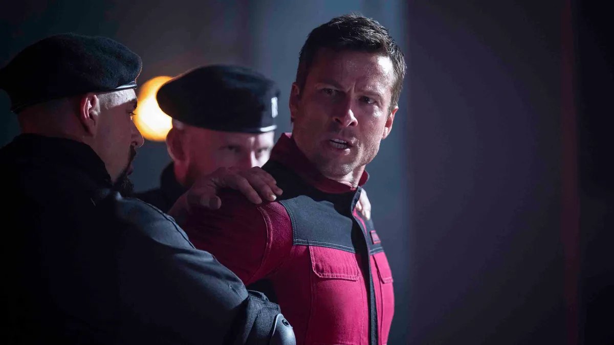 Stephen King, the author of 'The Running Man', discussing the new Glen Powell film adaptation's ending with a thoughtful expression.