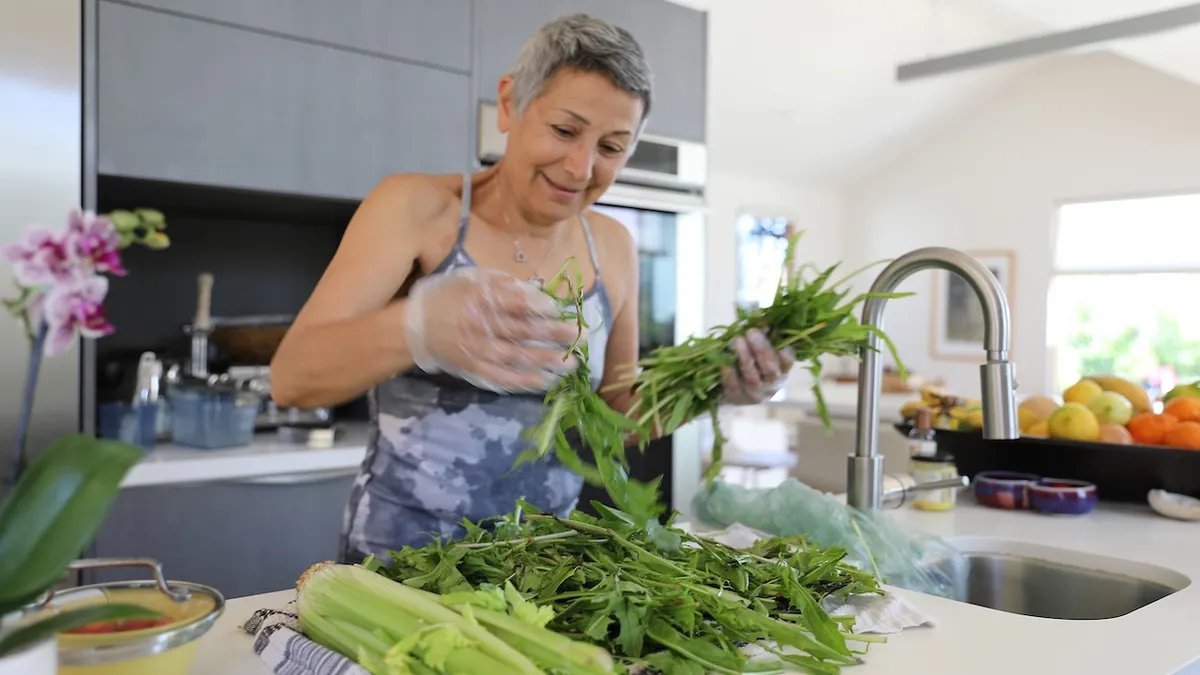 A scientist working in a lab, conducting research on cancer cell metabolism.
