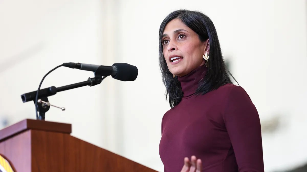Usha Vance looking thoughtfully at her bare ring finger.