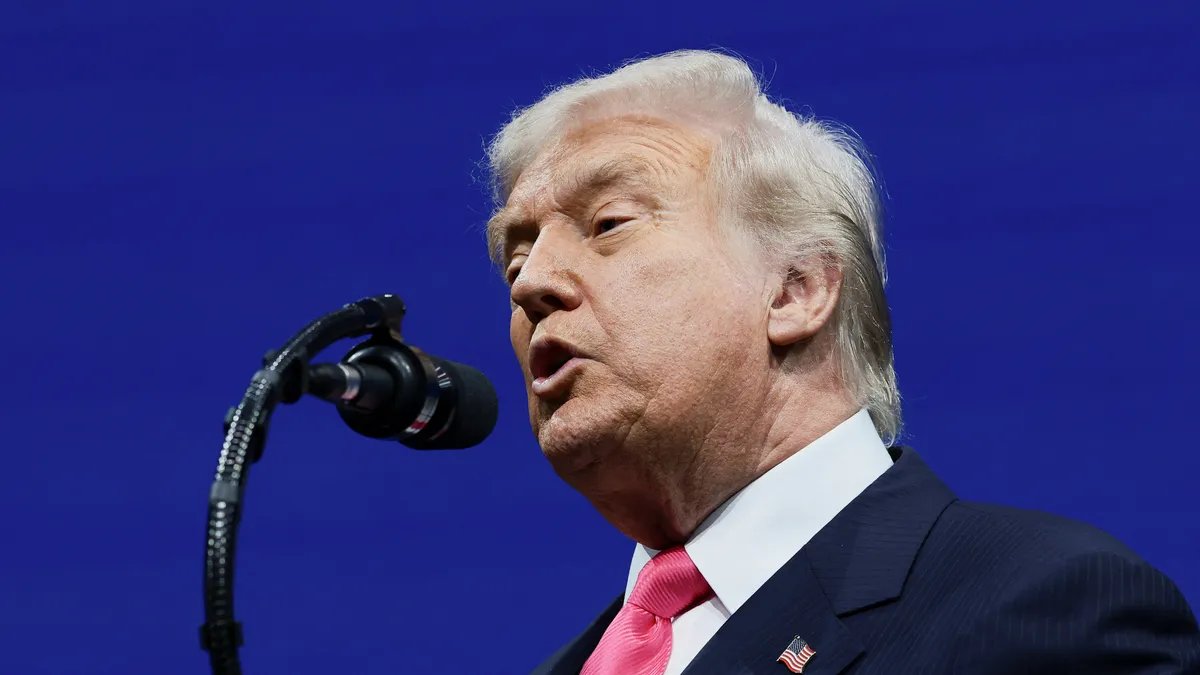 Donald Trump addressing supporters at a rally, emphasizing his denial of issuing death threats to Democrats.