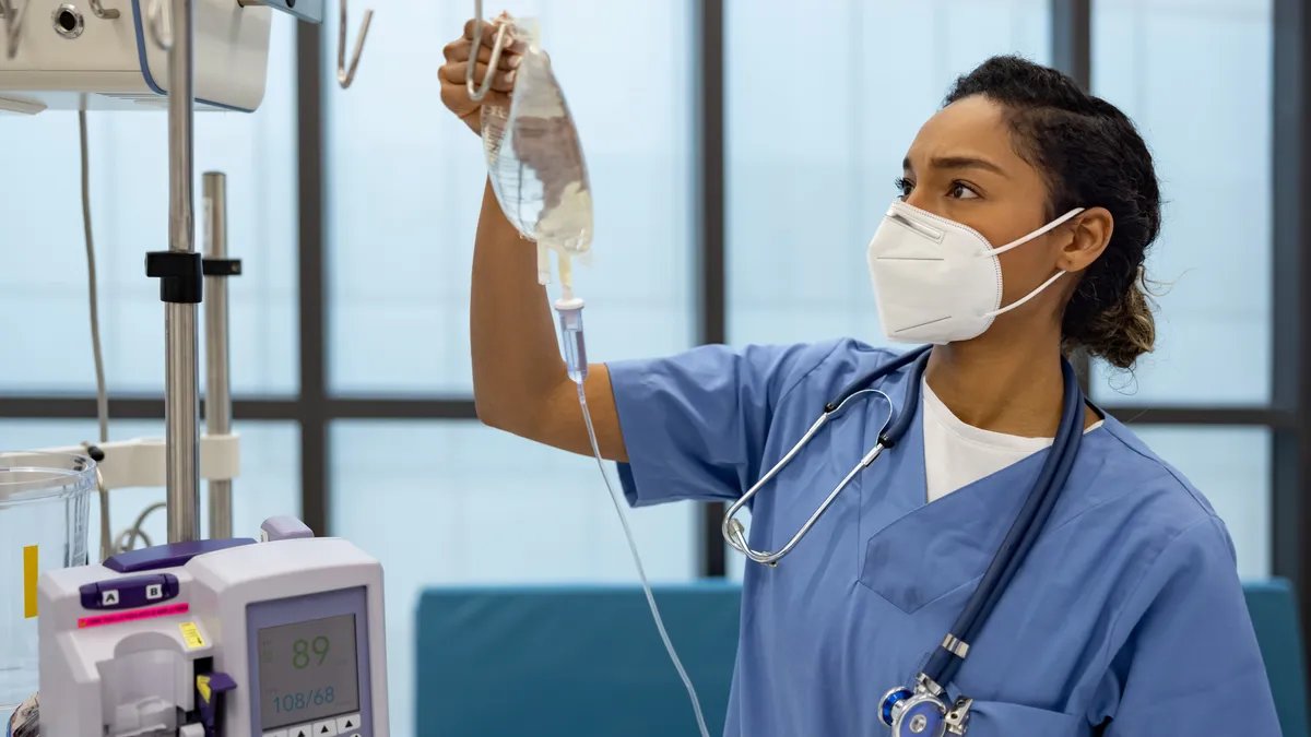 A group of nursing students studying together on a university campus.