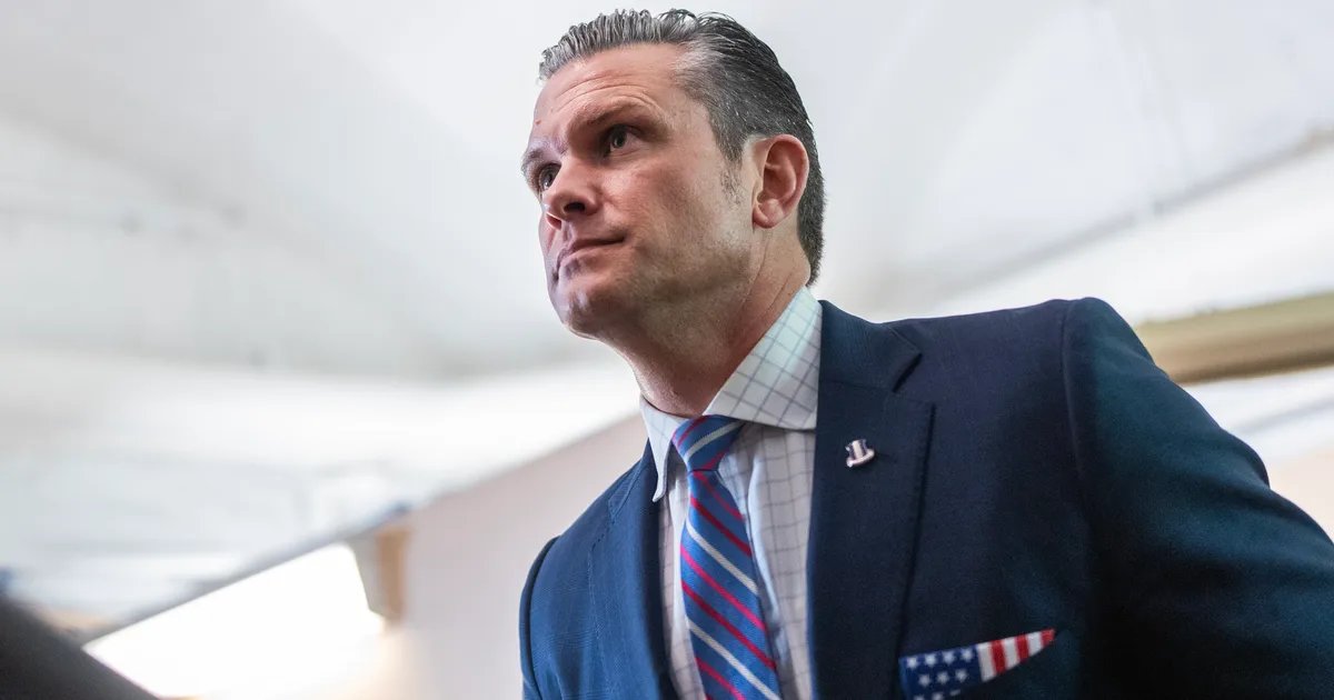 A Venezuelan flag waving in front of a cityscape.