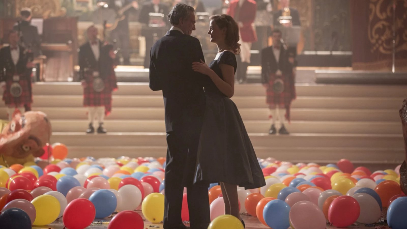 A person holding a remote control and browsing through streaming options on a smart TV.