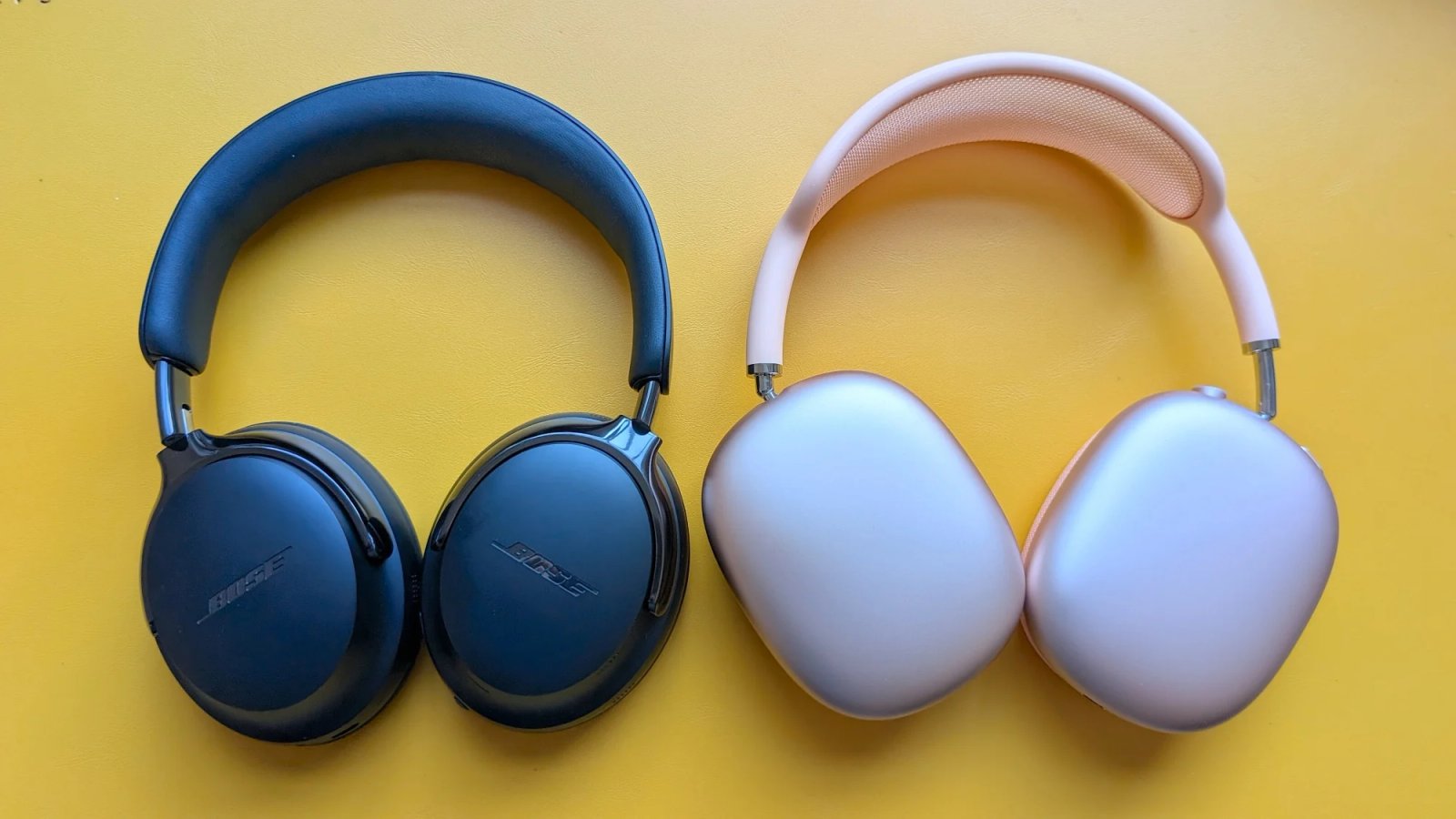 A person listening to music with the Bose QC Ultra (Gen 2) headphones in a busy city environment, highlighting their ability to block out distractions.