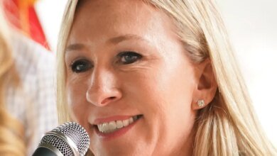 Why is Marjorie Taylor Greene resigning?