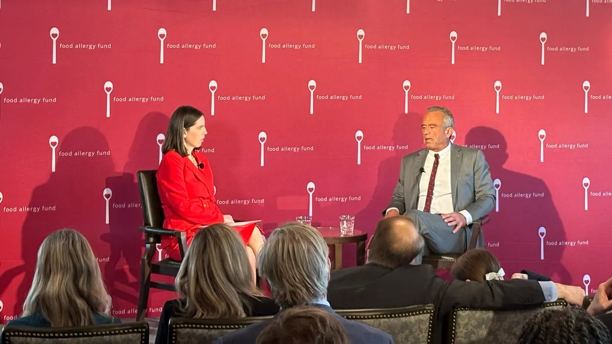 A person carefully reading food labels in a grocery store, emphasizing the vigilance required for managing food allergies.