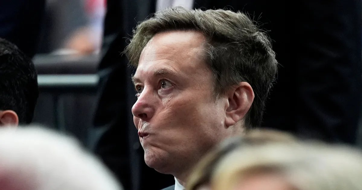 President Trump addressing the media, with a subtle smirk.