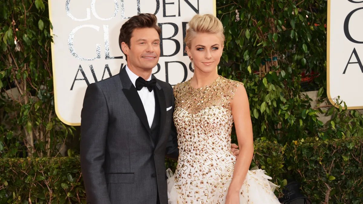 Julianne Hough and Ryan Seacrest pose together at a New Year's Eve event.