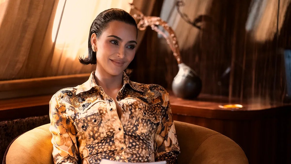 Kim Kardashian speaking on a panel about legal issues.