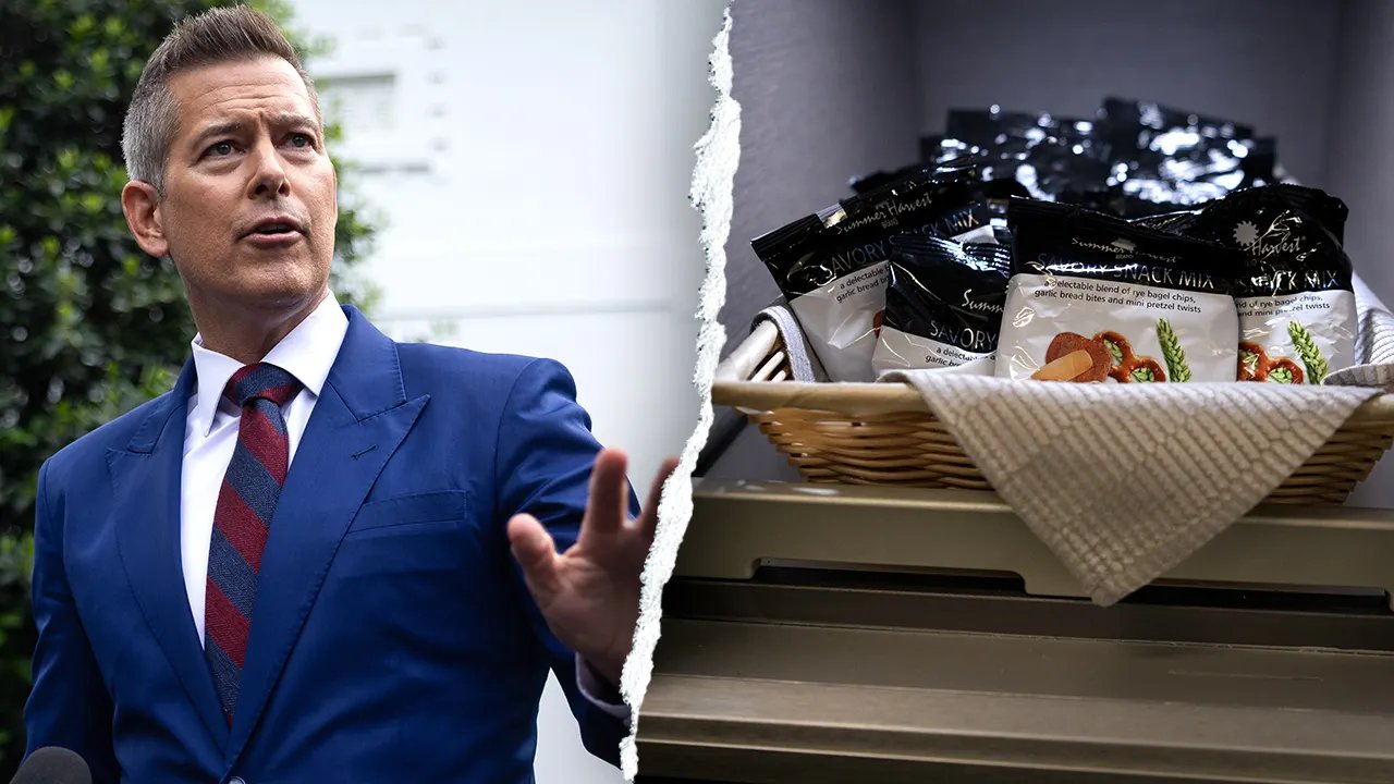 Various airplane snacks, including pretzels, cookies, and crackers, are displayed on a tray.