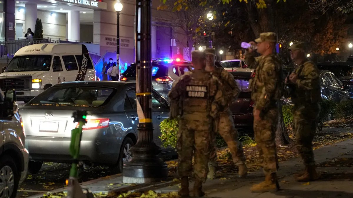 A crowd of Afghan refugees waiting in a processing center, their faces etched with worry and uncertainty.