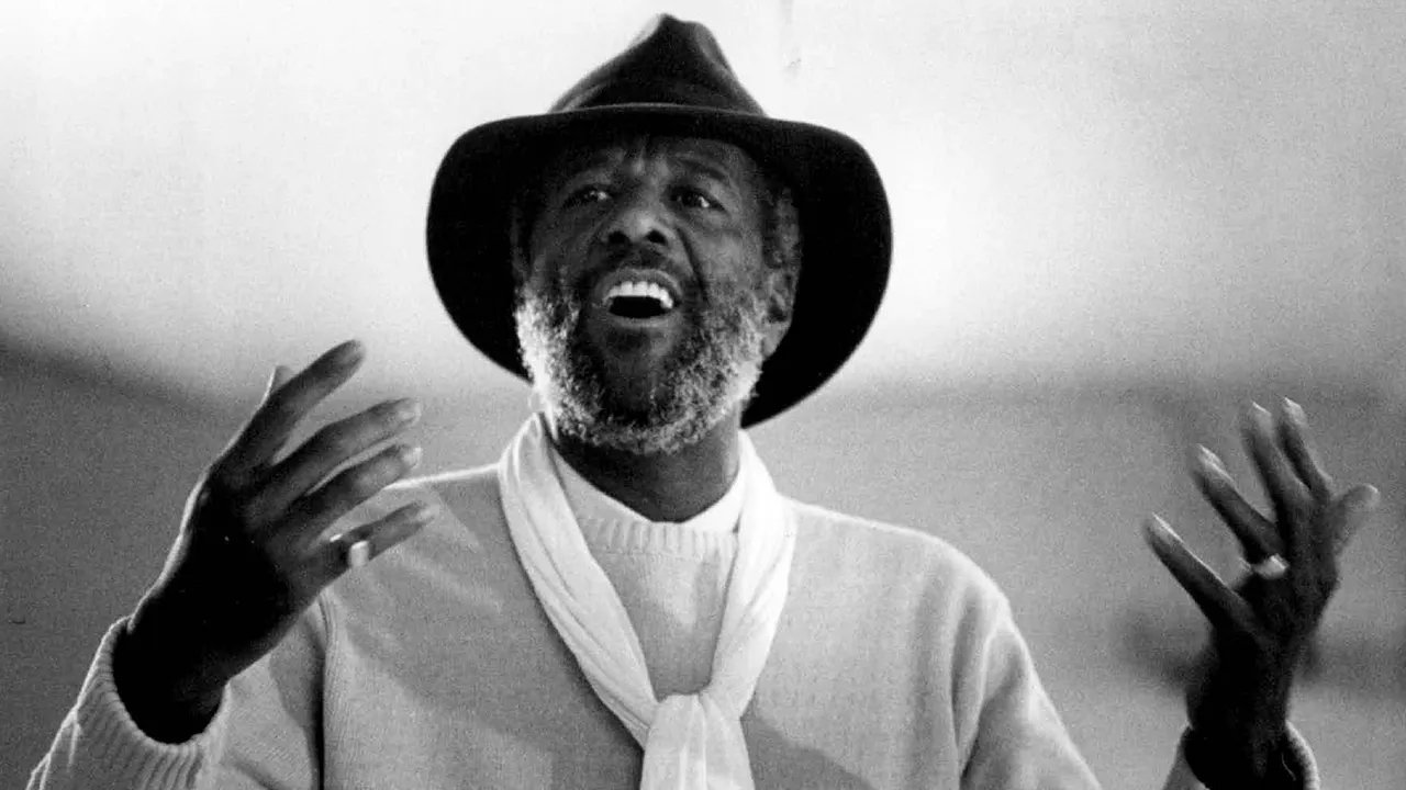 Wally Amos, the charismatic founder of Famous Amos, poses with his signature cookies.