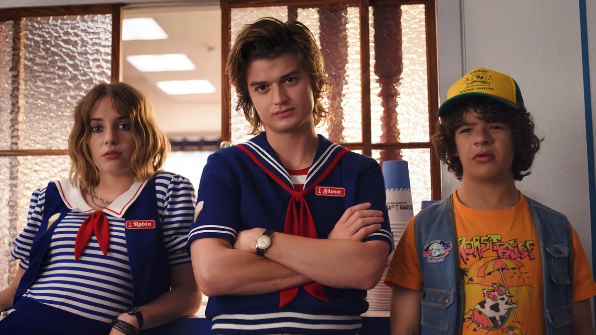 Joe Keery as Steve Harrington officiates a wedding.