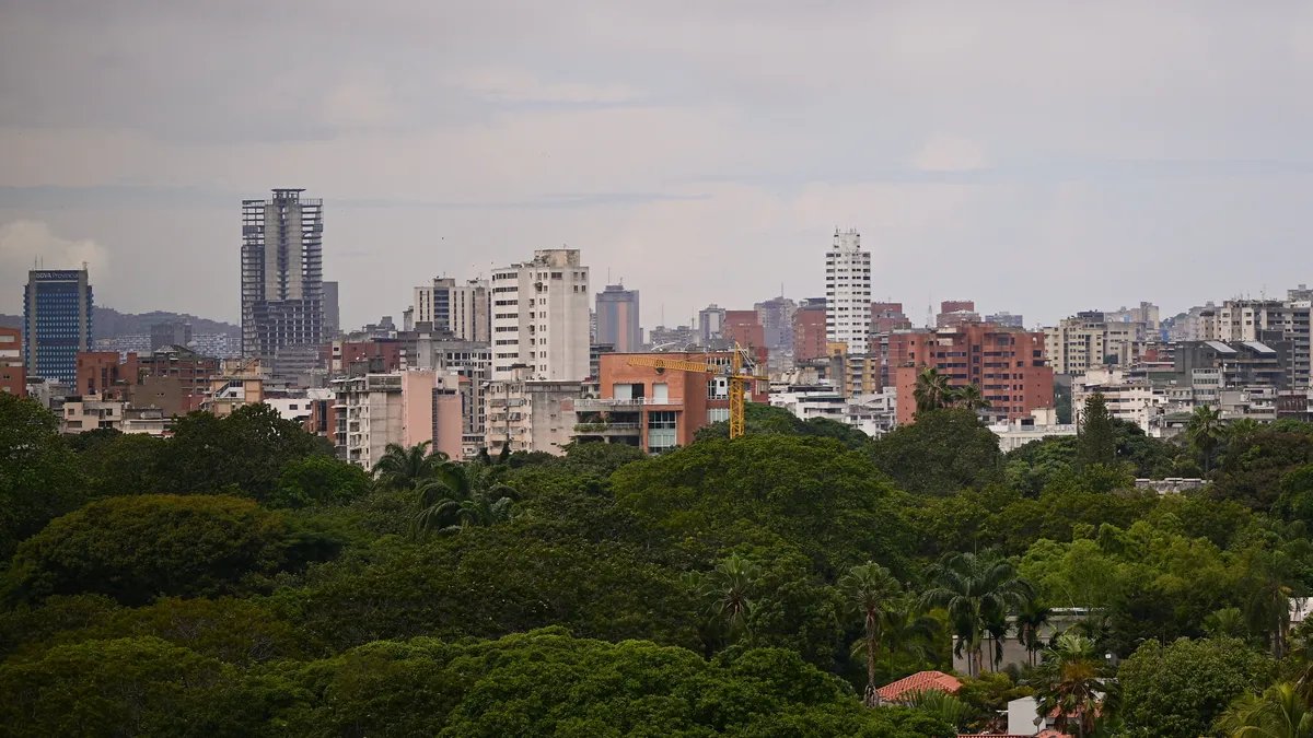 Former President Trump addressing a crowd, with the American flag in the background.