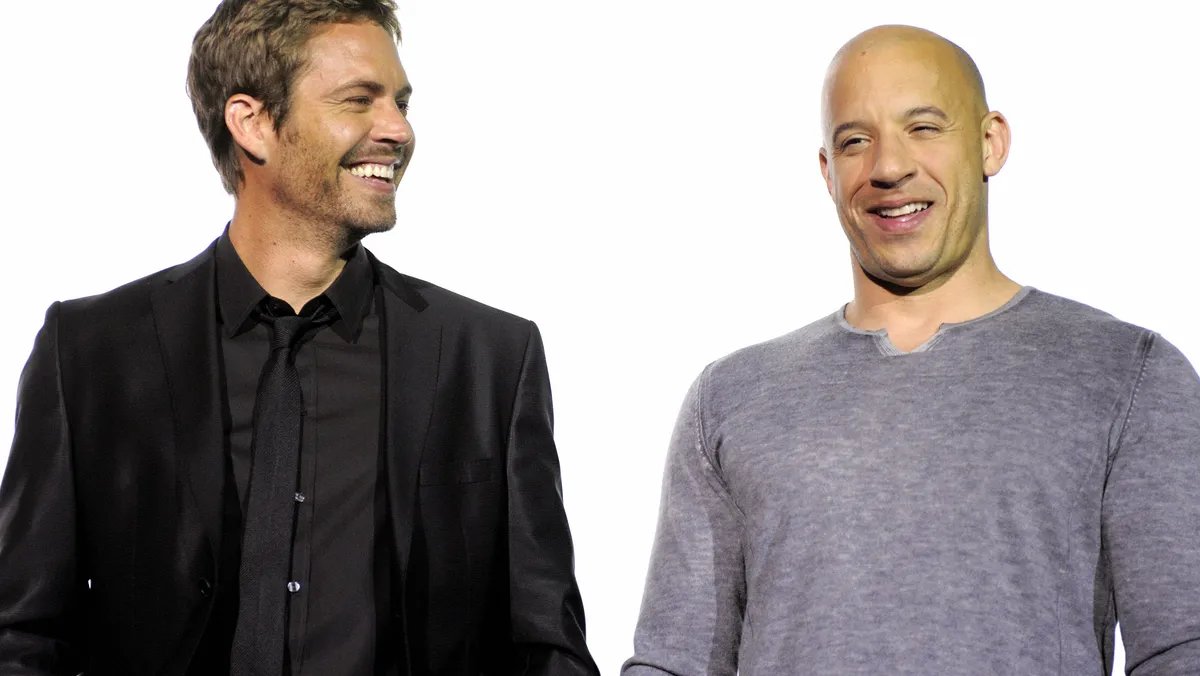 Vin Diesel and Paul Walker sharing a warm embrace on a movie set, embodying their strong friendship.