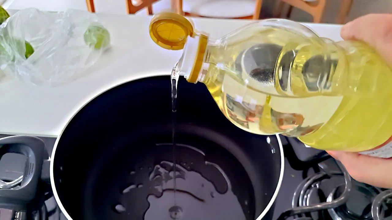 Various bottles of cooking oils on a supermarket shelf, highlighting the ubiquity of soybean oil.