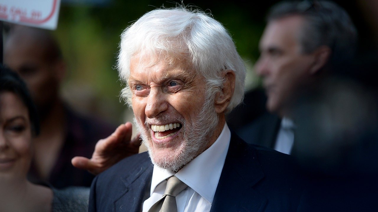 Dick Van Dyke smiling broadly at an event.