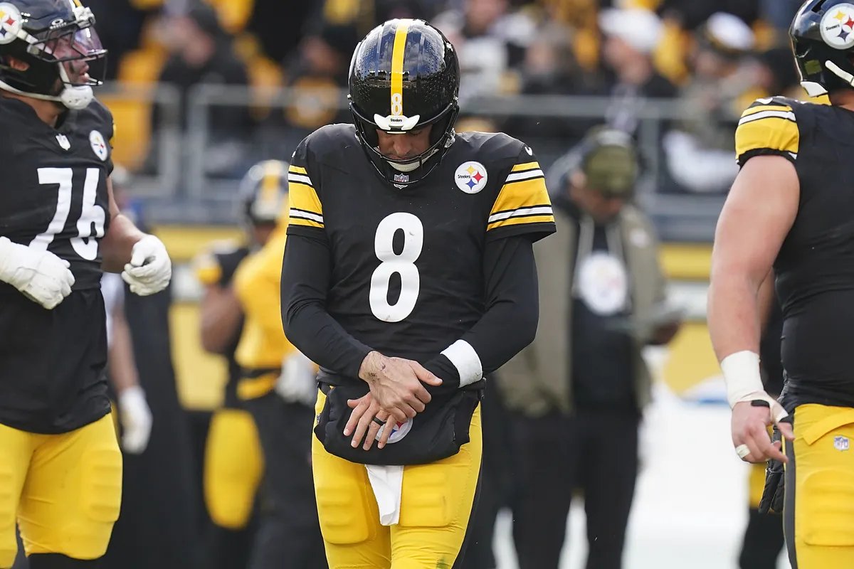 Aaron Rodgers in Steelers uniform, looking determined.