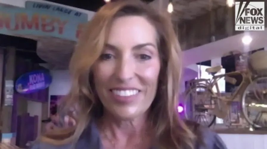 A server happily accepting a tip from a customer in a restaurant setting.