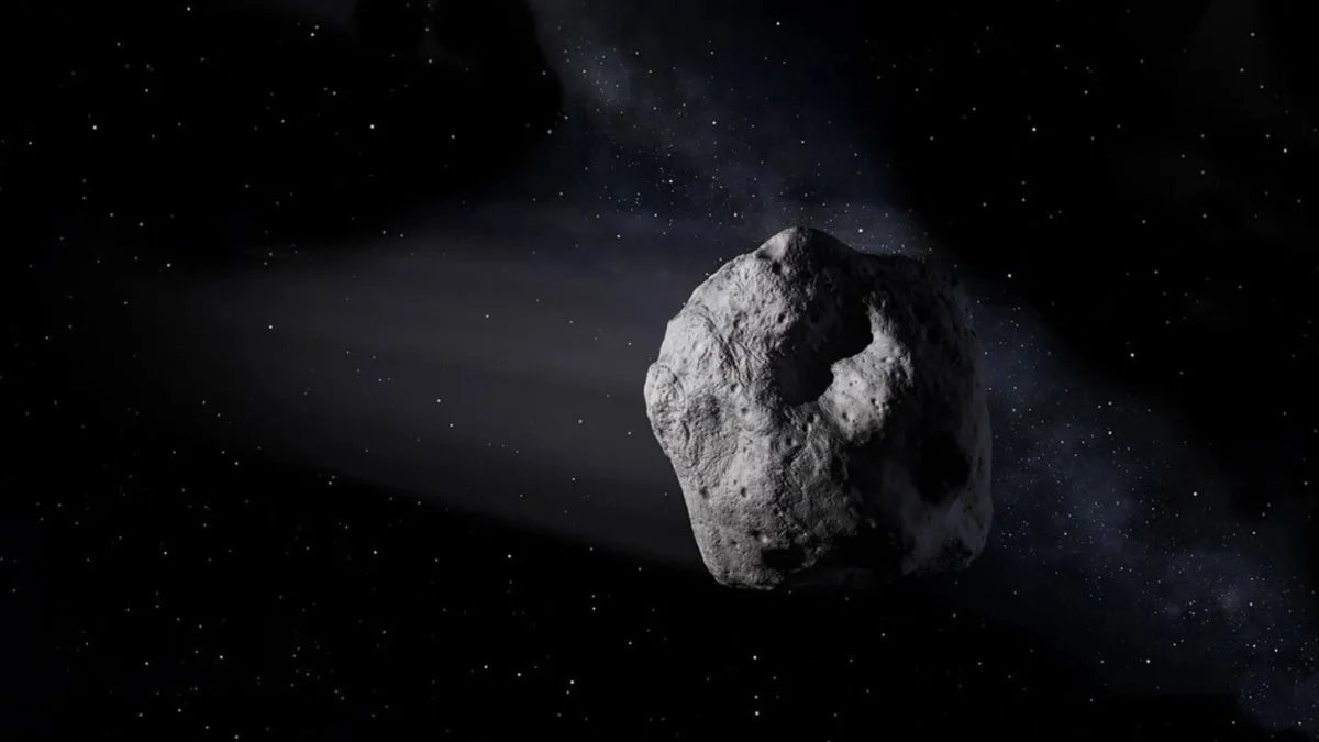 A digitally rendered image of a small asteroid orbiting Earth, with the moon visible in the background.
