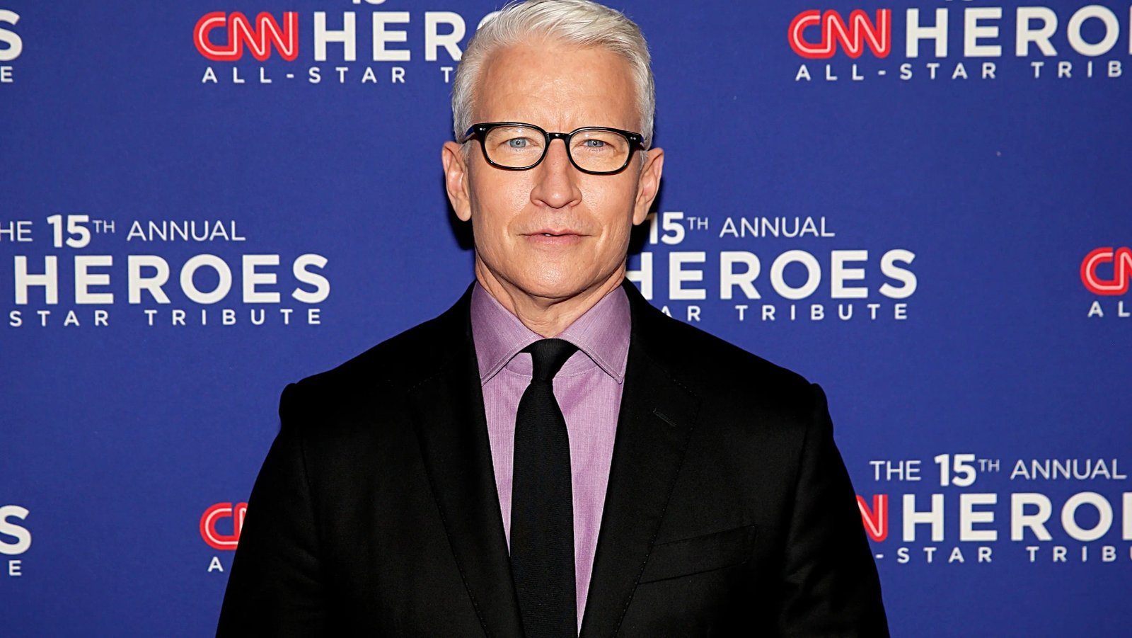 Close up of Anderson Cooper's face during the podcast recording, showing a tear.