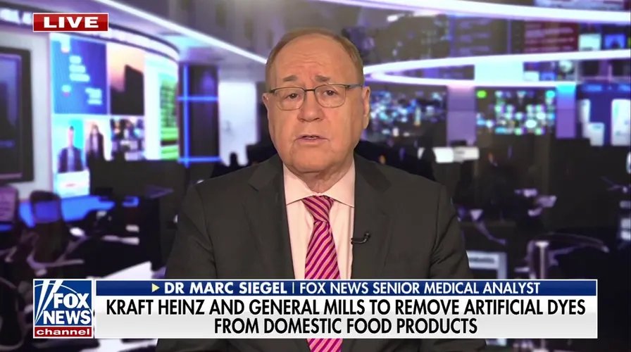 A selection of anti-aging superfoods like blueberries, spinach, and olive oil.