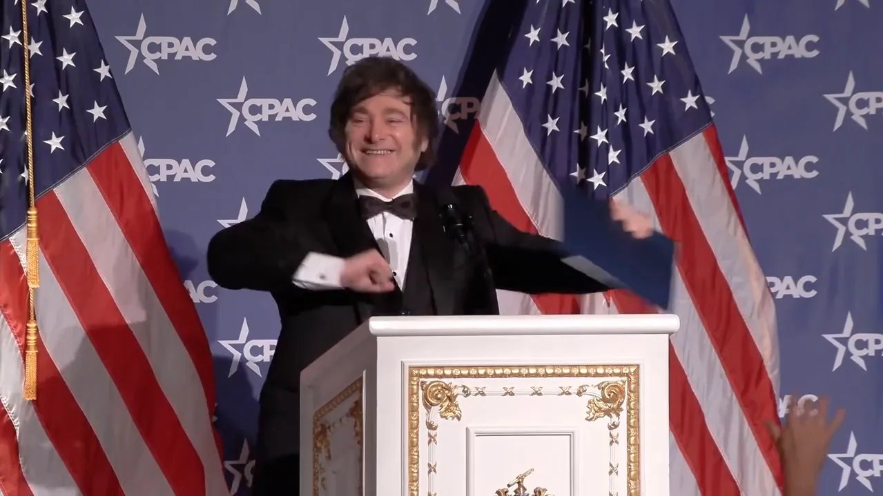 A crowd of people at a political rally.