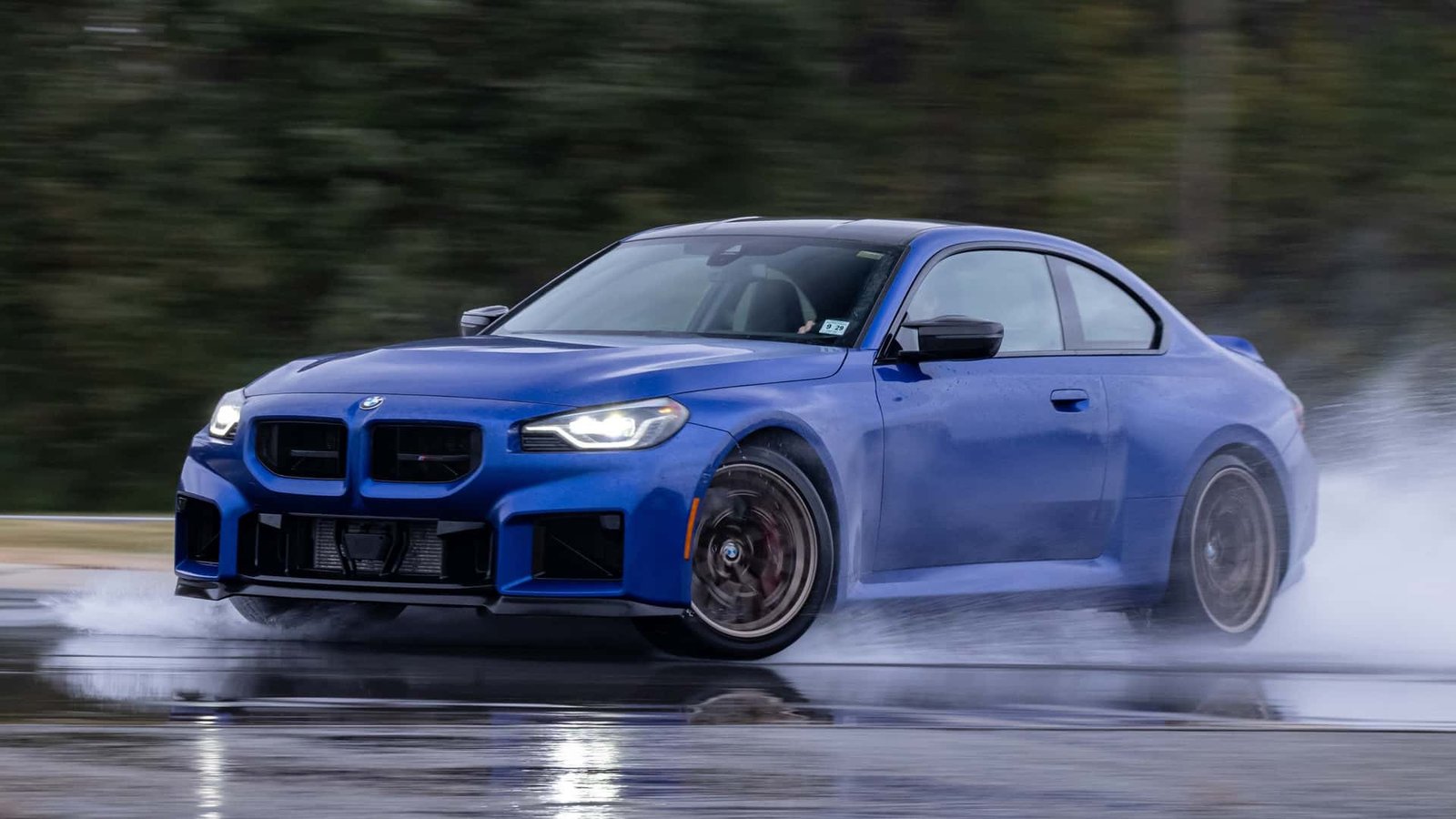 BMW M2 CS speeding on a track