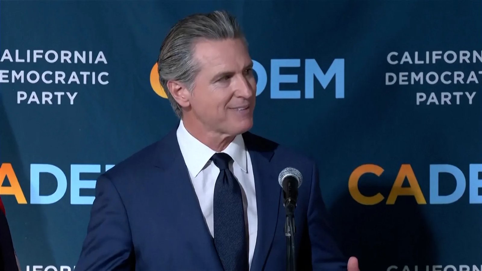 A close-up shot of Eric Swalwell smiling during his campaign launch.