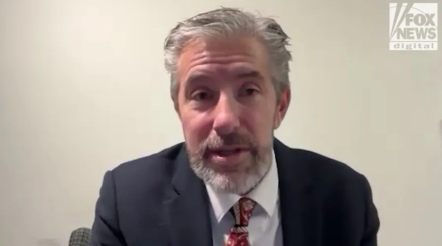 Close-up shot of a nutrition label on a processed food item, highlighting the high sodium and sugar content.