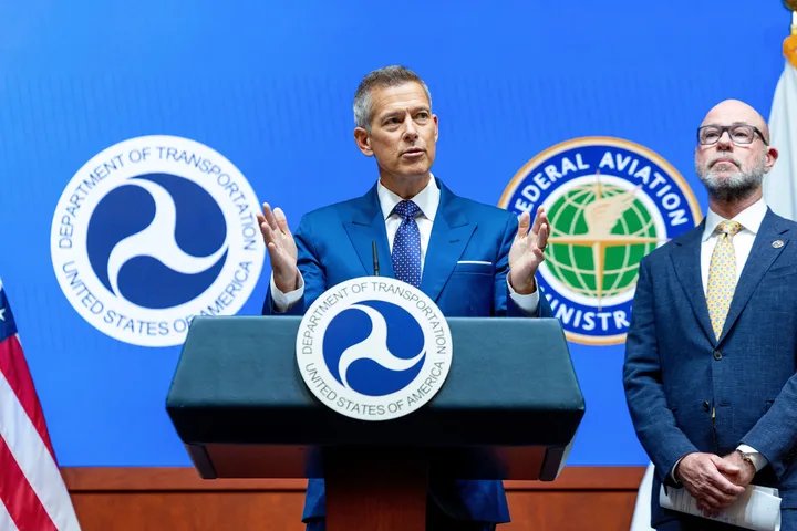 Air traffic controller working at their station, highlighting potential for fatigue.