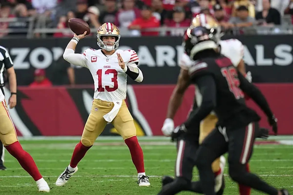 Fantasy football players reacting to a game on TV.