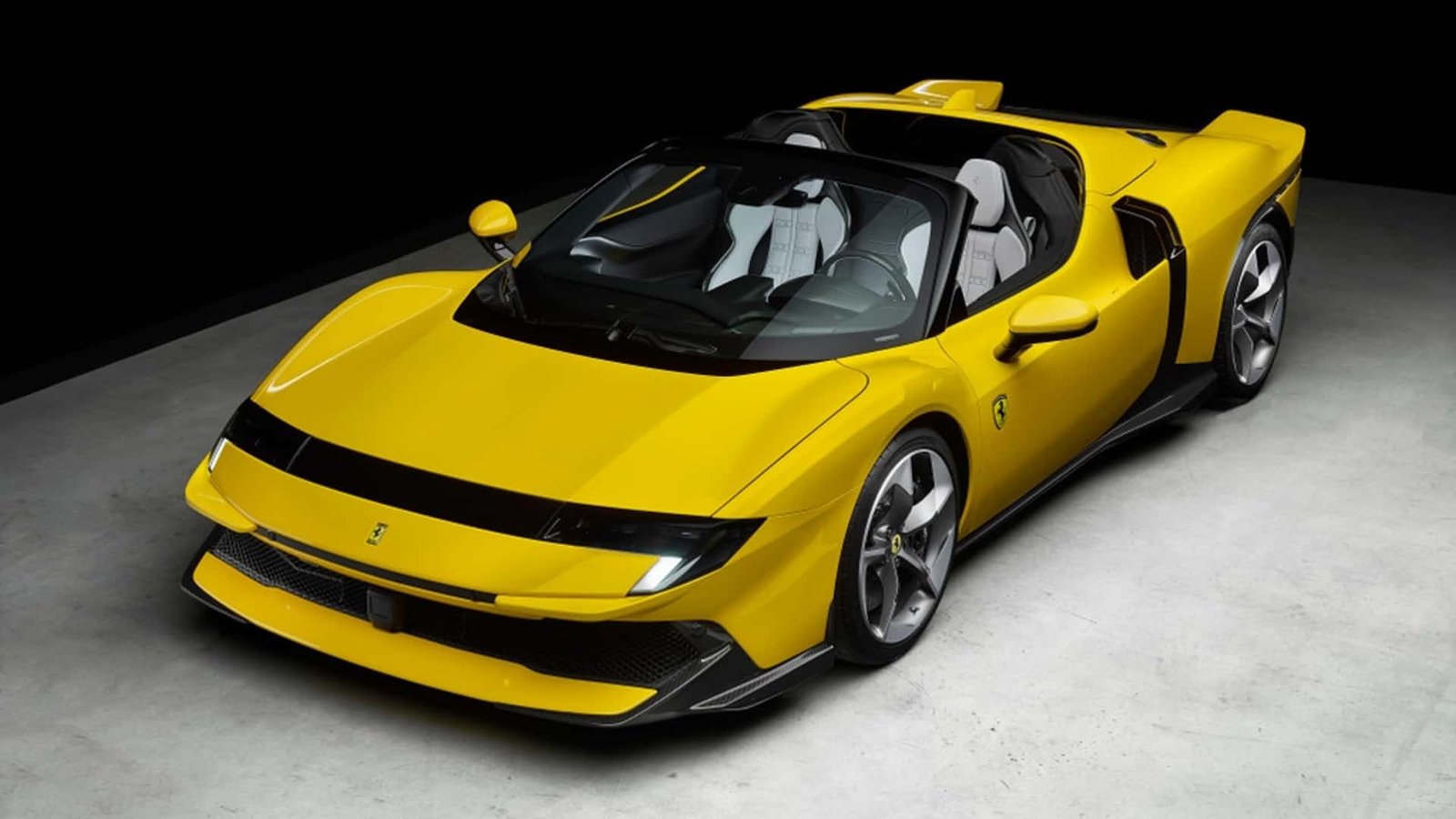 A sleek, red Ferrari supercar sits gleaming in a luxurious showroom, awaiting its eager, patient owner.